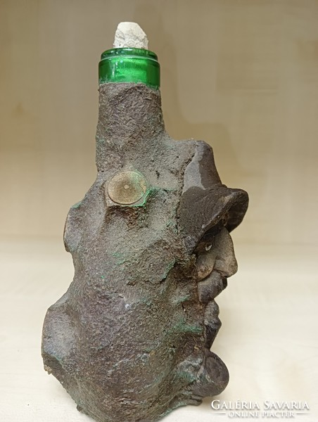 Glass bottle with human head