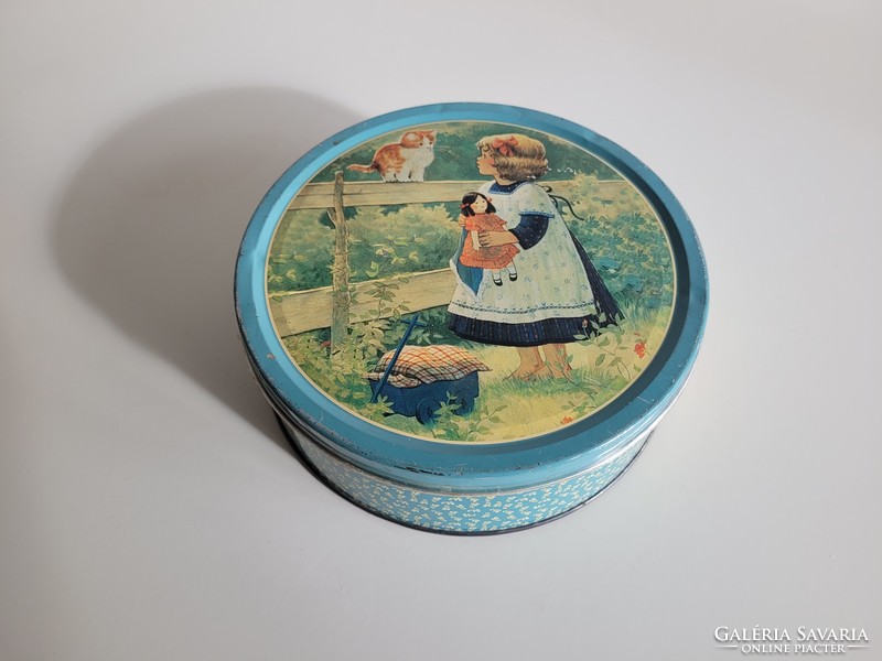 Retro metal biscuit box with a pattern of a little girl and a kitten