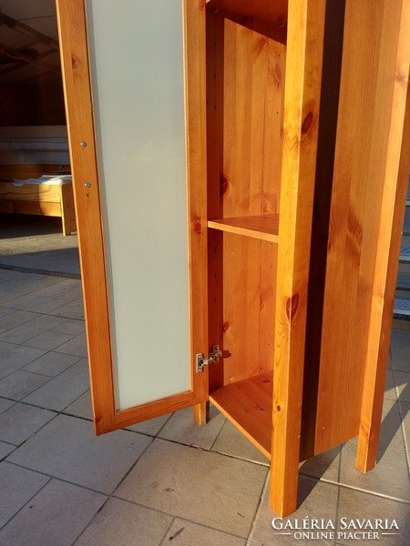 A narrow pine display case with frosted glass is for sale. Furniture is in good condition