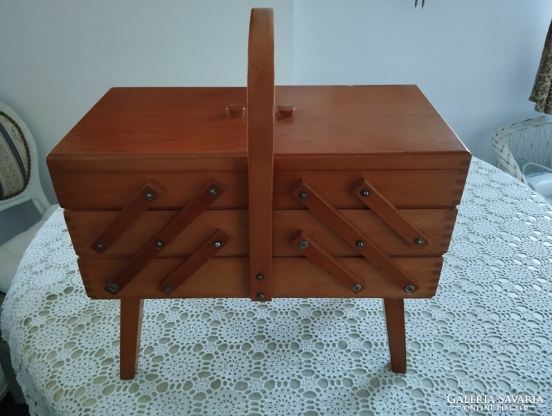 Wooden sewing box on legs in good condition