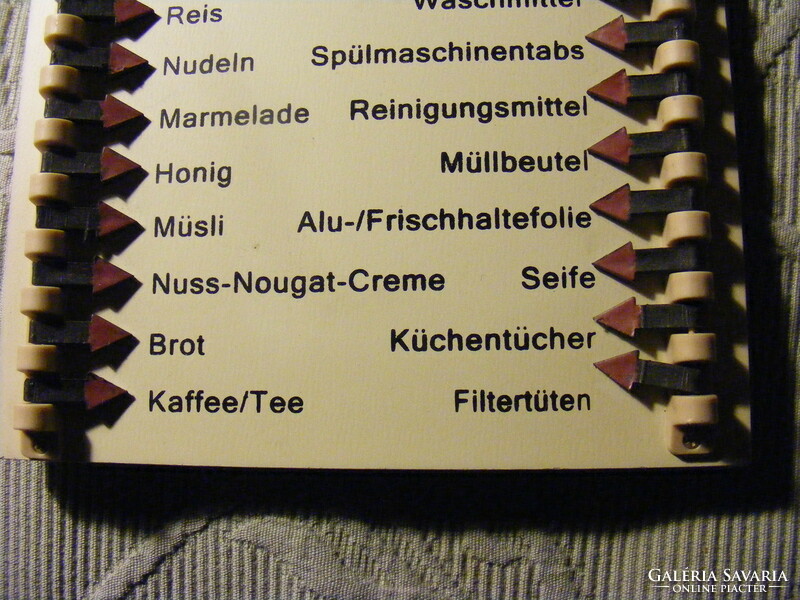 Wall shopping list board with marking pins in German - einkaufsliste
