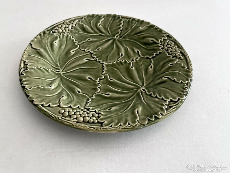 Old, antique green grapes, faience with a leaf pattern, majolica plate