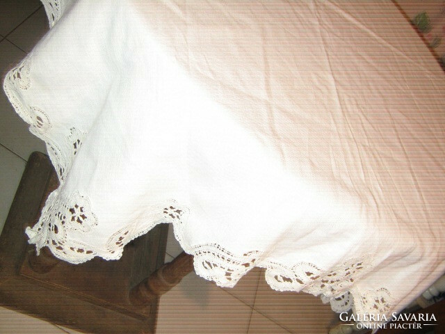 Beautiful elegant light tablecloth with white lacy edges