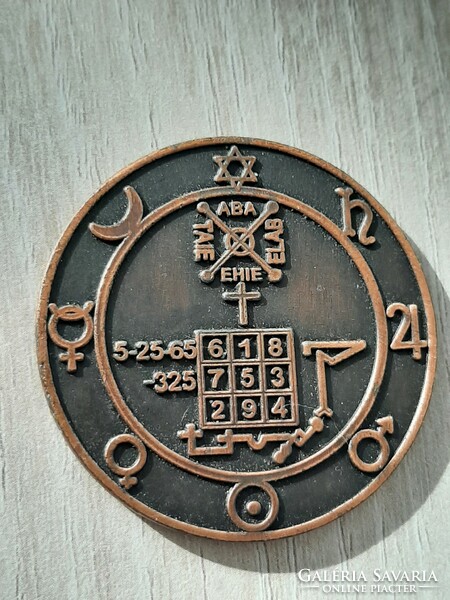 Mythological bronze amulet with symbols