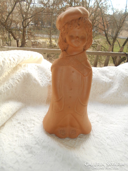 Statue of charming terracotta girl in Fabian zone