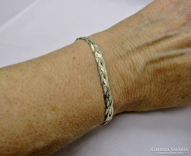 A very beautiful silver bracelet with a delicate braided pattern