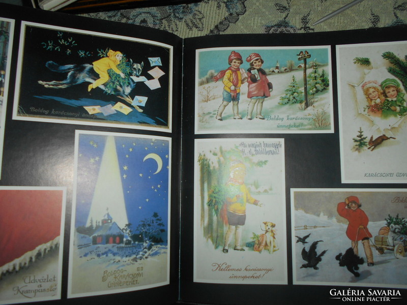 Christmas on old postcards, a collection of old Christmas postcards in a book