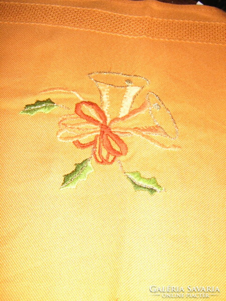 Wonderful Christmas bell with hand embroidered orange tablecloth