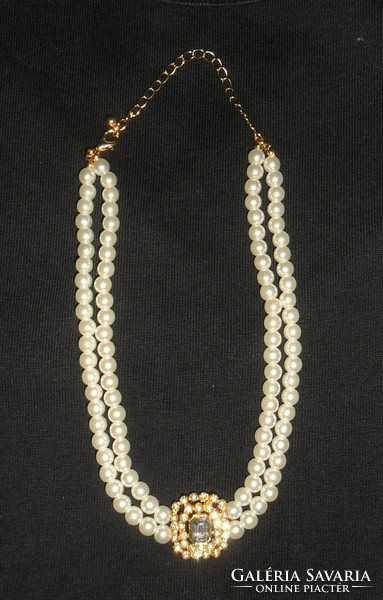 Elegant, beautiful, shiny double row of pearls with a pendant decorated with stone and zirconia.