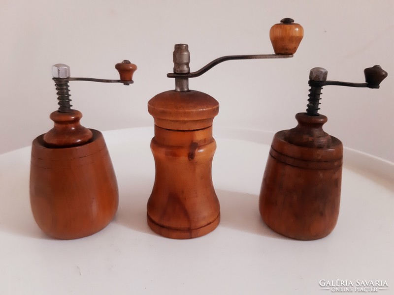 Old wooden pepper mills in a package