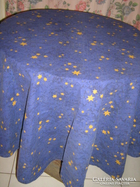 Tablecloth with yellow stars on a beautiful dark blue pattern