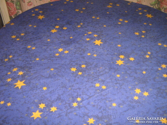 Tablecloth with yellow stars on a beautiful dark blue pattern