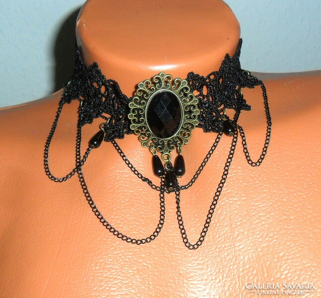 Gothic style collar made of blue black lace, decorated with a stone pendant, glass drop, and chain. Adjustable.