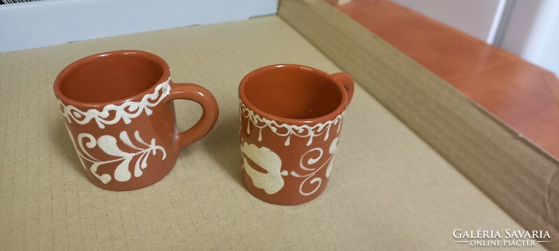2 ceramic coffee cups with a folk pattern