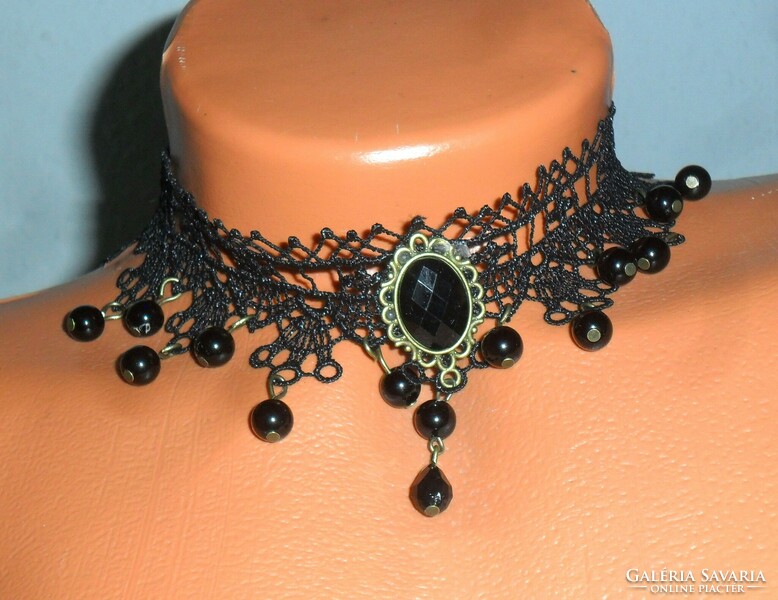 Gothic style collar made of blue black lace, decorated with pendants, glass drops and pearls. Adjustable.