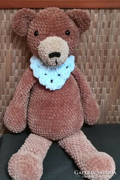 Brown teddy bear with a blue scarf - fluffy and big