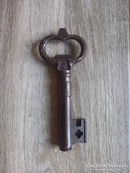 Nice old bronze corkscrew and bottle opener in one (12.3x5 cm)