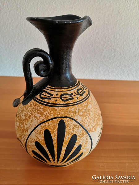 An authentic copy of an antique jug with a seal