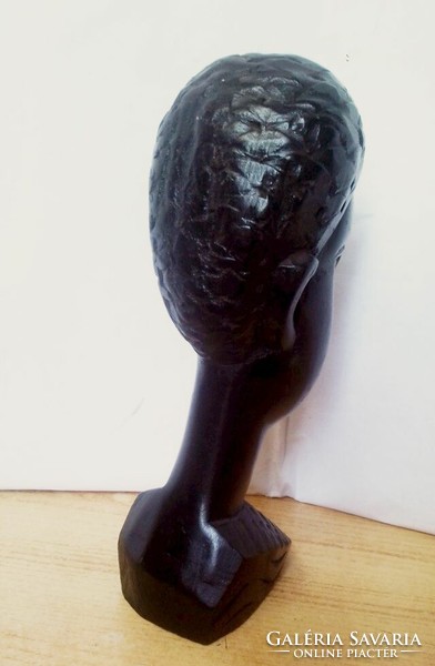 Ebony colored native sculpture, black polished head sculpture from South Africa