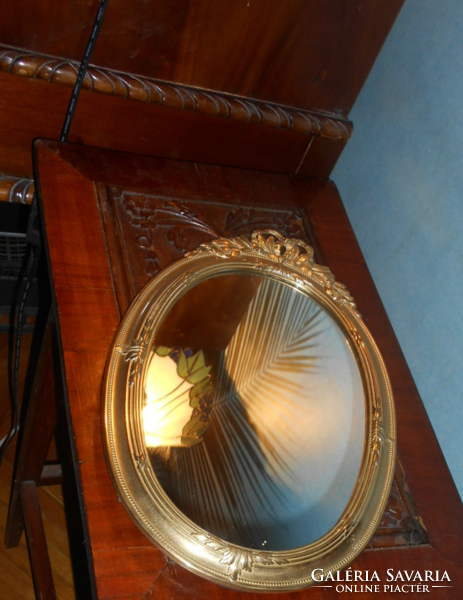 Baroque style wall mirror in a copper frame