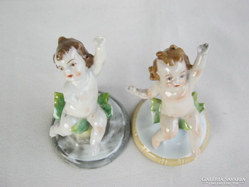 Pair of antique marked miniature porcelain puttos - damaged