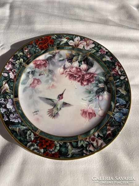 A dreamy lena liu porcelain numbered decorative plate that can also be hung on the wall