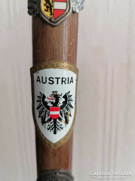 Antique hiking stick with badge and stick label