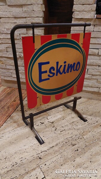 Retro eskimo ice cream advertisement with stand