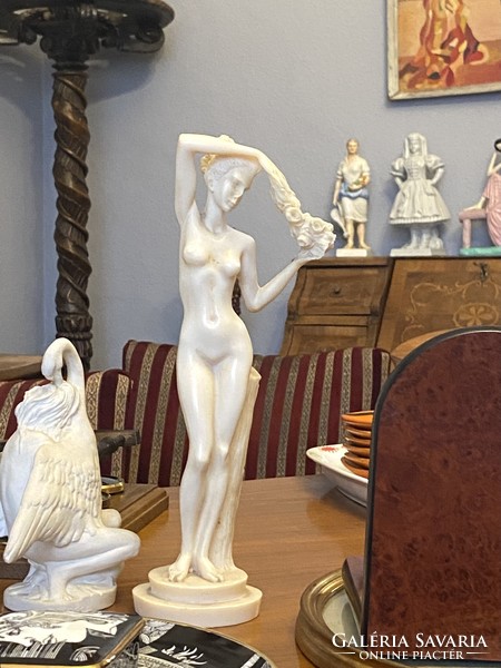 Dancing nude female nude cast bone colored plastic statue 29 cm