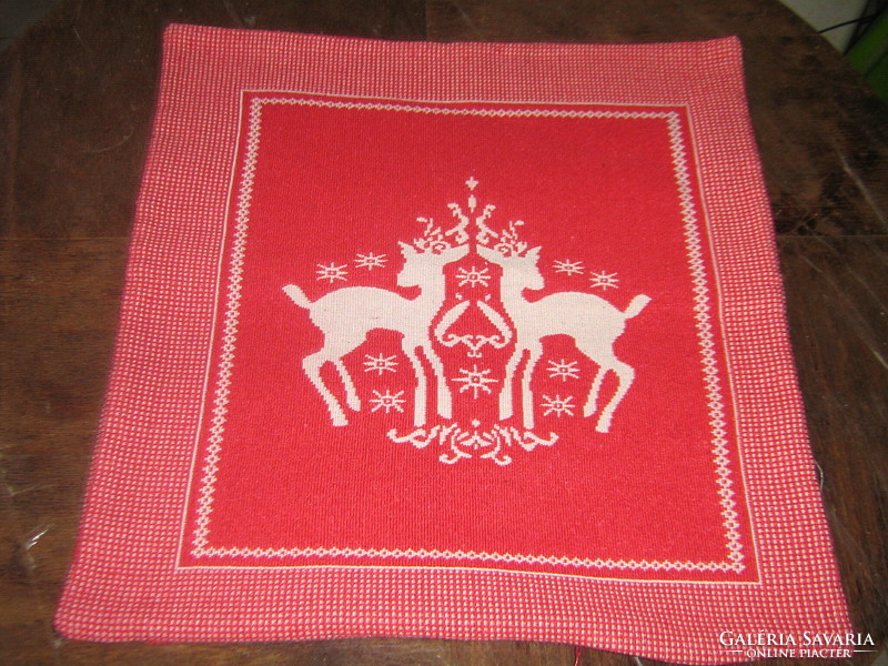 Beautiful decorative pillow with a woven deer pattern