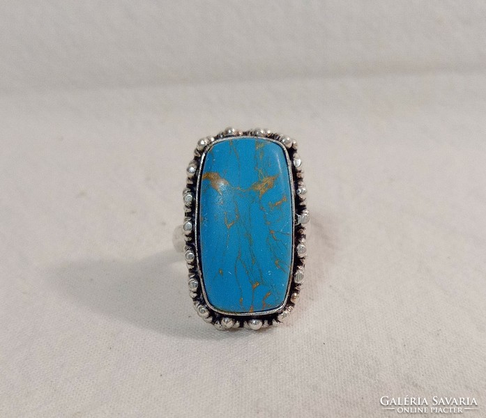 Old silver ring with huge turquoise