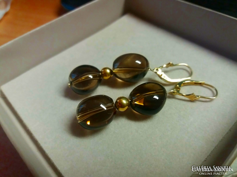 14th century Gold earrings with smoky topaz spheres.