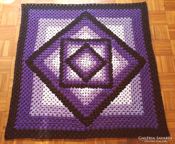 Crochet carpet with a geometric pattern