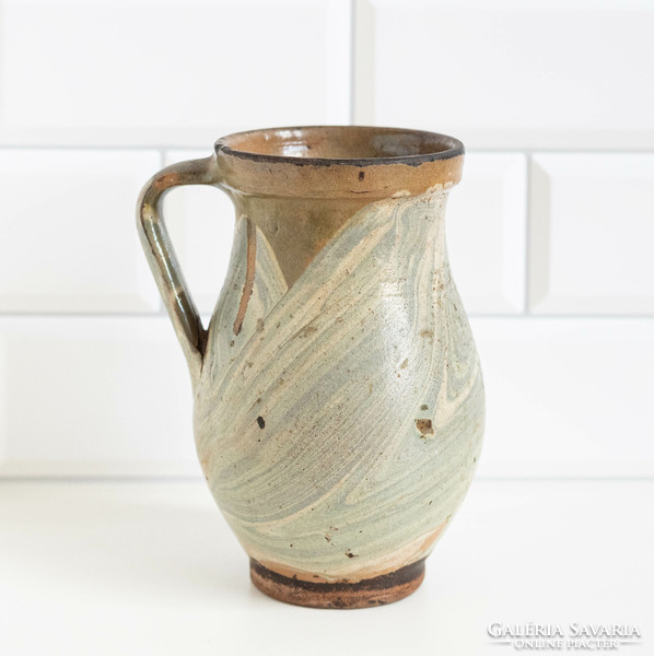 Old ceramic jug with a marble-patterned glaze, pitcher, pitcher