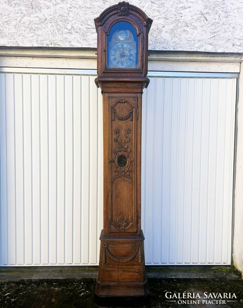 Antique standing clock.