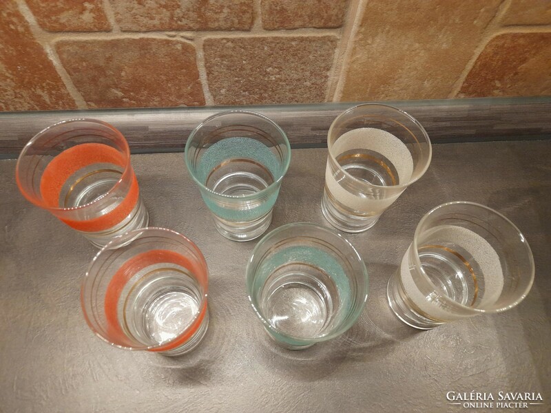 Retro glass cup set, with gold decor, colored surface.