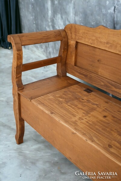 Folk-style wooden bench seat with storage