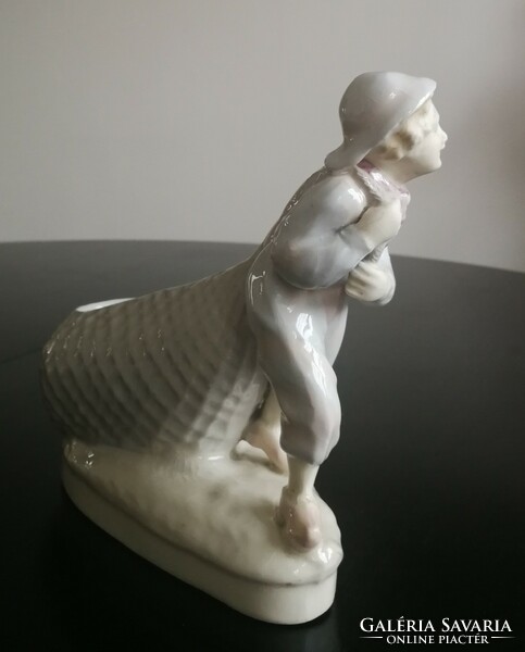 Antique statue - the boy pulling the net