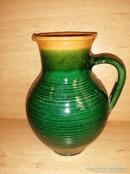 Green glazed ceramic jug, spout 23 cm