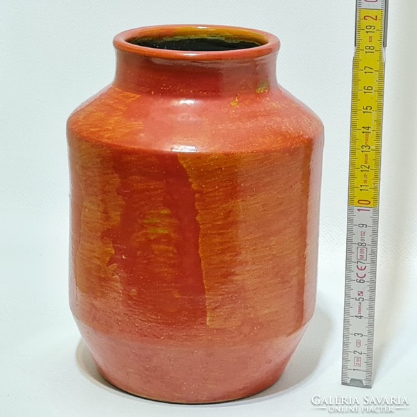 Orange glazed ceramic vase marked 