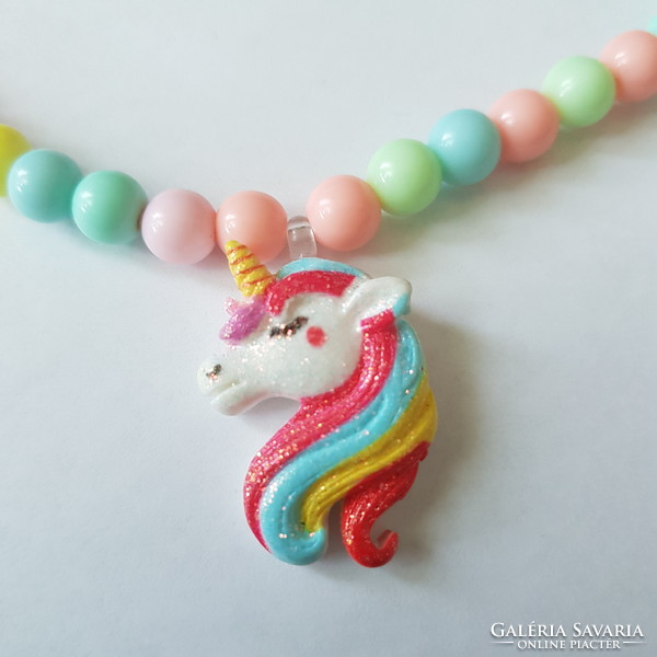 New, glittery, colorful plastic children's necklace with a shiny unicorn pendant