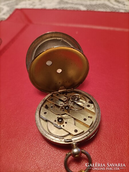 Flawless silver pocket watch with key