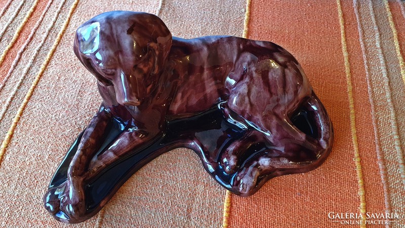 Large old ceramic dog. Injured. 20 cm long.