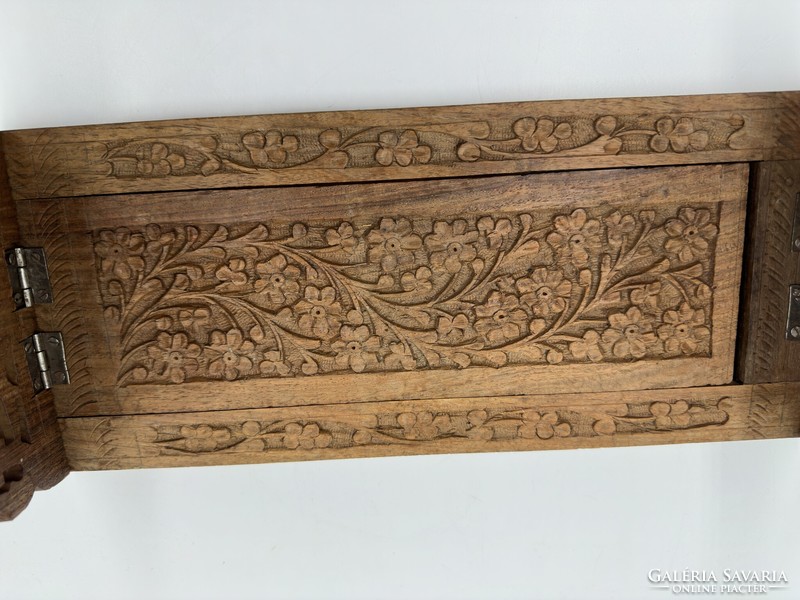Carved bookend with grape and flower ornamentation