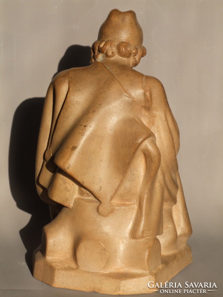Terracotta statue of Louis Kasztner, a shepherd stuffing his pipe (191221)