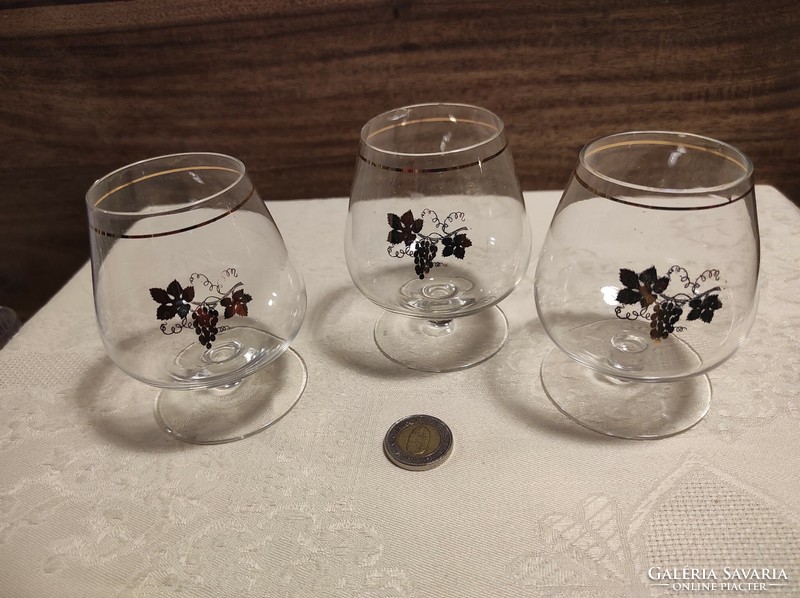 3 wine glasses with a golden grape pattern