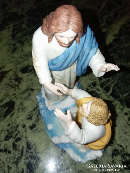 Porcelain statue of Jesus. Prayer.