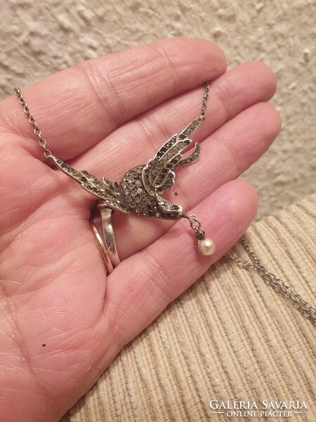 Silver necklaces with a beautiful bird