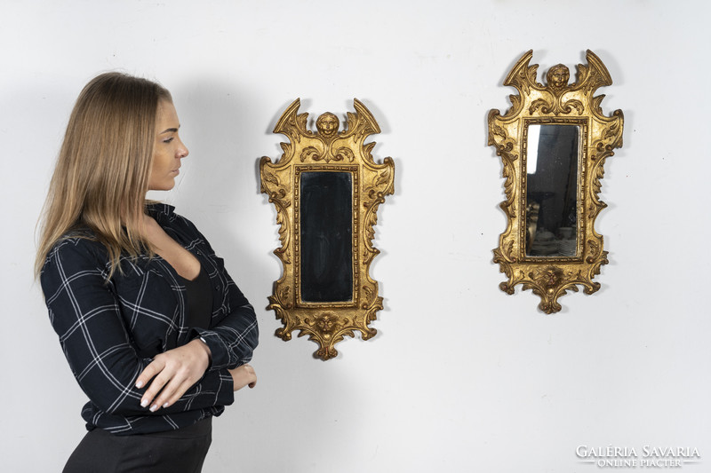 A pair of gilded wooden framed mirrors