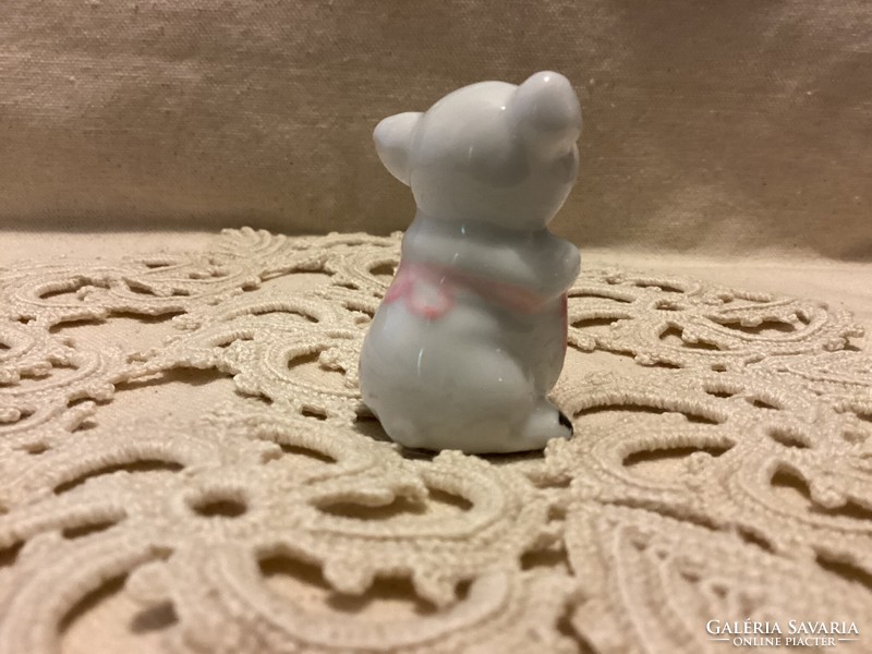 Miniature porcelain figurine pig woman
